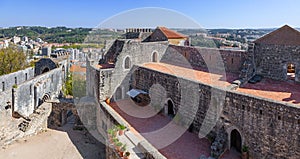 The Palatial Residence (Pacos Novos) on the right, and the ruins of the Nossa Senhora da Pena church on the left