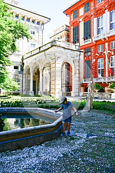 Little tourist near Palazzo Rosso ,Genoa , Italy photo