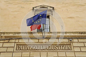 Palazzo di Giustizia. Palace of Justice in Lecce, Italy. Former Convent of the Jesuits. European and italian flag on facade photo