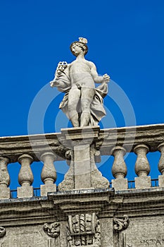 Palazzo Maffei with statue of divinitiy at Piazza delle Erbe in Verona, Italy