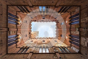 Palazzo pubblico, a medieval building and tower in Siena old town, Tuscany, Italy