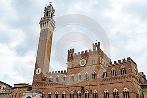 Palazzo Pubblico and the tower Torre del Mangia in the city square Piazza del Campo