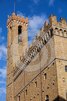 Ancient medieval palace Palazzo Vecchio of Florence with tower and crenellation. photo