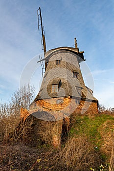 Palczewo, pomorskie / Poland Ã¢â‚¬â€œ December, 11, 2019: Old destroyed wooden Dutch windmill. Wooden structure for flour milling