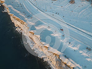 Paldiski in winter, road on a steep bank by the sea