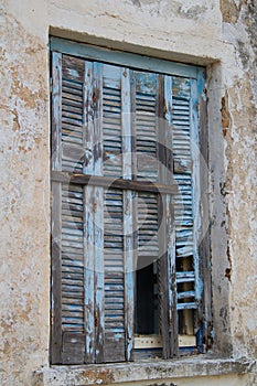 Pale blue weathered shutters