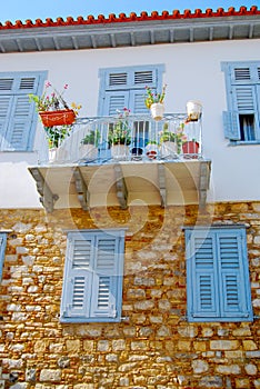 Blue Window Shutters on Stone House