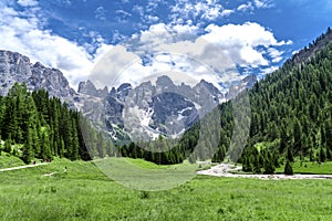 Pale di San Martino range panorama landscape during summer season. Passo Rolle summer landscape - Pale di San Martino range.