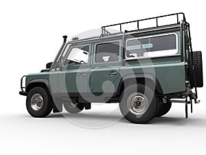 Pale metallic green four wheel drive - off road car - side view