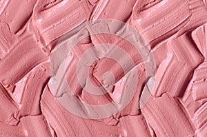 Pale pink cosmetic clay alginate facial mask, face cream, body wrap texture close up, selective focus. Abstract background with