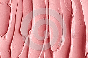 Pale pink cosmetic clay alginate facial mask, face cream, body wrap texture close up, selective focus. Abstract background