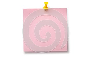 Pale pink sticker on yellow thumbtack photo