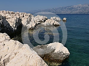 Pale rocky cliffs on beach in northern Dalmatian beach Radanovac near Razanac town.