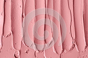 Pale rose cosmetic clay alginate facial mask, face cream, body wrap texture close up, selective focus. Abstract pink background