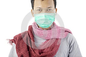 Pale unidentified man wearing mask and scarf
