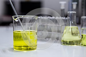 The solution of an emulsifier in a beaker for formulation test of the cosmetic product