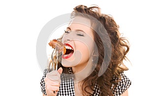 Paleo diet concept - woman eating meat
