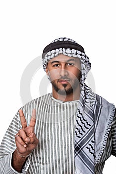 Palestinian Arab man showing peace sign and standing against isolated white background