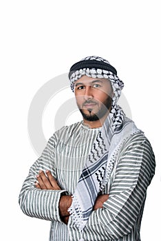 Palestinian Arab man in traditional costume standing with his hands folded