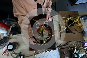 Palestinian Haya Abu Daqqa and Areej Al-Saqqa work in their Antica store in Khan Yunis in the southern Gaza Strip