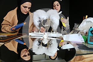 Palestinian Haya Abu Daqqa and Areej Al-Saqqa work in their Antica store  in Khan Yunis  in the southern Gaza Strip