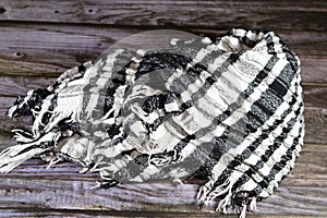 The Palestinian keffiyeh, a distinctly patterned black and white scarf that is usually worn around the neck or head, a symbol of