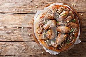 Palestinian musakhan or sumac chicken closeup on the table. horizontal top view