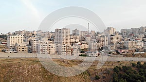 Palestinian refugees camp Shufat Behind concrete Wall Aerial view