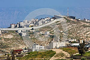 Palestinian town behind separation wall in Israel. photo