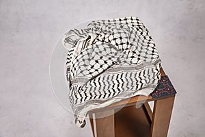 Palestinian Traditional Keffiyeh Scarf on wooden Table