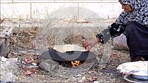 Palestinian woman baking bread 2