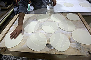 Palestinians working in a small bakery supported by a European charity