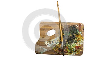 Palette and a brush isolated on a white background