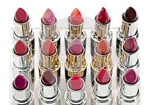 Palette of luxury lipstick tubes of colors ranging