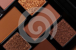 A palette of makeup shadows as an abstract background. MUA and girly concept. Luxury Eyeshadow palette, cosmetics product as luxur