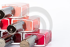 A palette of nail polish bottles on a white background