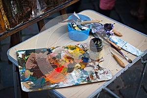 Palette with paintbrush and palette-knife