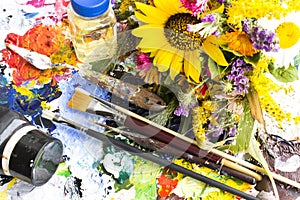 Palette with Painting Material and a Bouquet of Summer Flowers