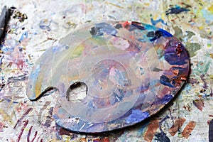 palette with watercolor paint. Not new, artistic designs. Creative space of the artist