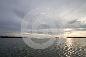 Palic Lake, in Subotica, Serbia, with a green lawn in the background, during aan autumn sunset.