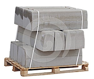 Pallet with a stack of concrete curbstone