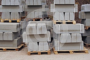 Pallet with a stack of concrete curbstone