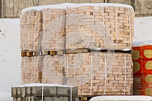 Pallets with bricks in the store. Racks of brick.