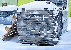 Pallets with bricks in the store. Racks of brick