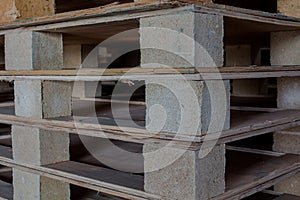 The pallets inside warehouse for support packing.