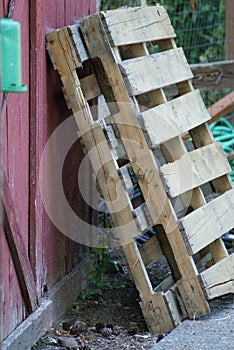 Pallets leaning against a Barn