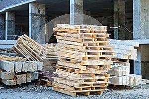 pallets, reinforced concrete blocks, building brackets