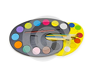Pallette with brushes on a white background