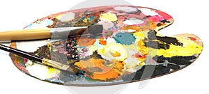 Pallette with brushes on a white background