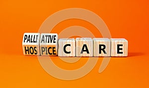 Palliative or hospice care symbol. Concept word Palliative care Hospice care on wooden cubes. Beautiful orange table orange